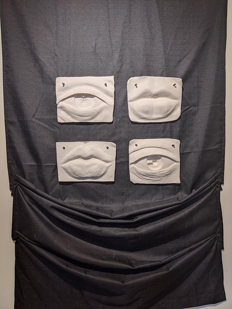 Clay sculptures for Pieces Exhibit of mouths and eyes