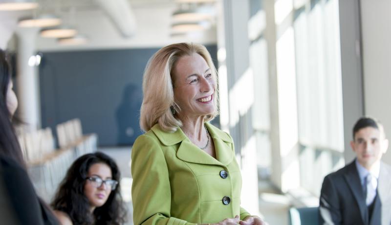Sue Henderson, Ph.D. smiling as she speaks with students.
