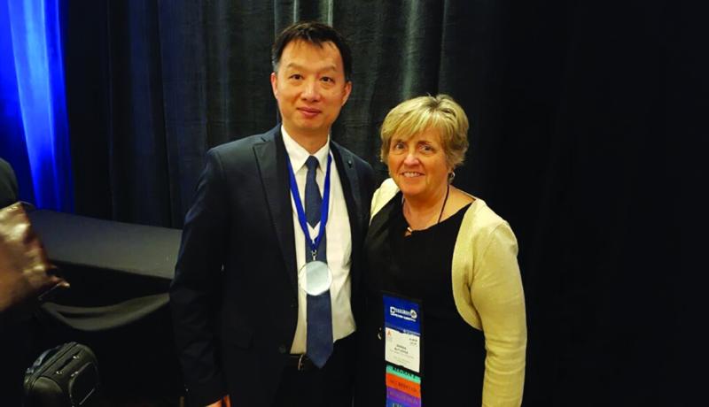 Dr. Rick Lee standing with Dr. Wanda Rutledge after receivin ABCSP award.