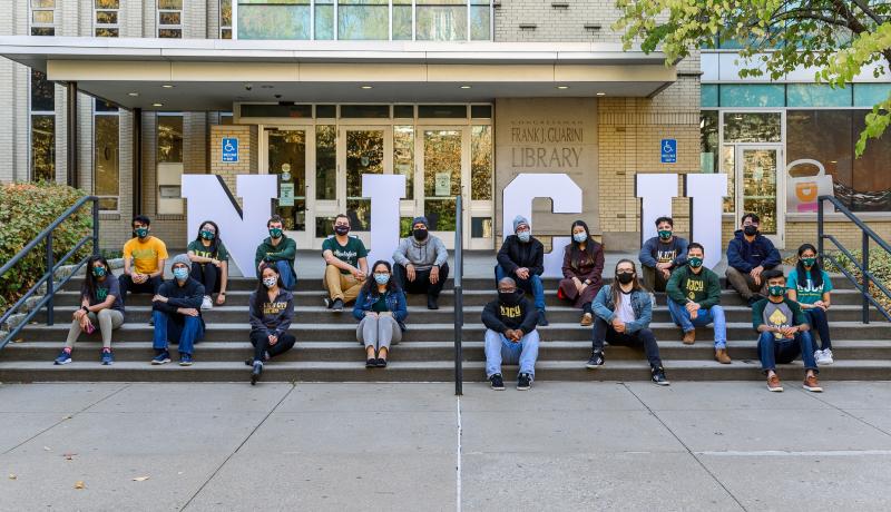 NJCU Students on the steps of the Guarini Library