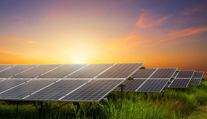 Solar panel on dramatic sunset sky background