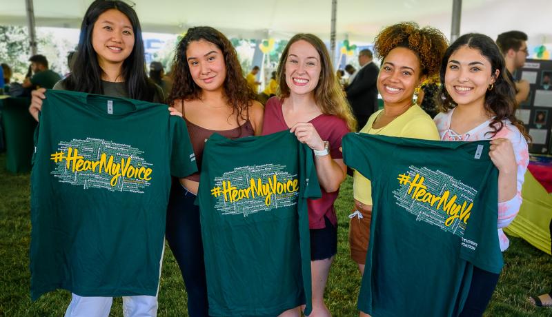 NJCU students holding Hear My Voice T-Shirts at Orientation