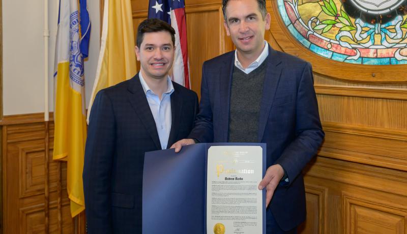 Mayor Fulop presents a proclamation to President Acebo