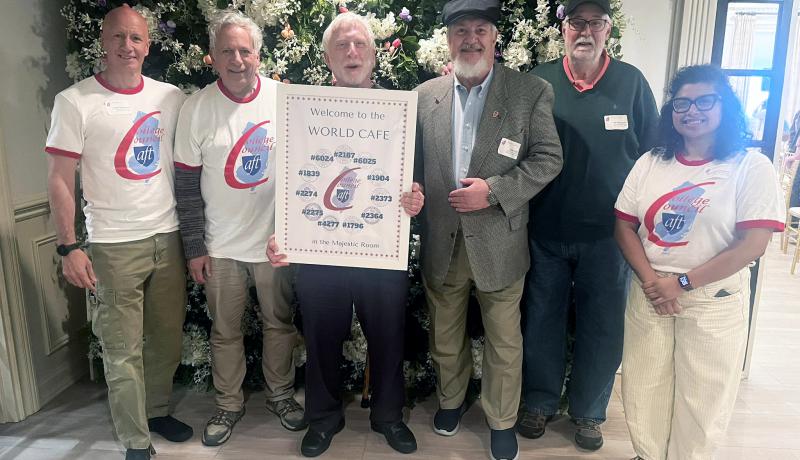 AFT leaders at a recent event. AFT Local 1839 Bill Calathes holding a sign in the middle.