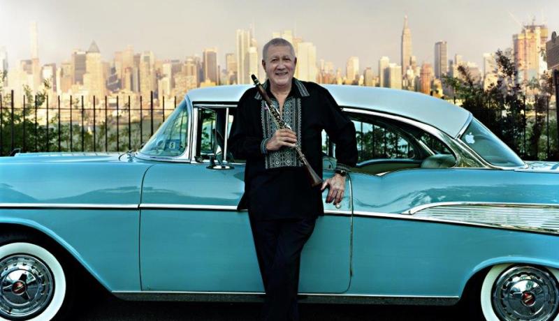 Paquito D'Rivera, jazz star, GRAMMY Award-winner, Hudson County native posing with a classic car and the New York City skyline