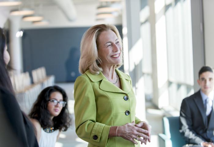 Sue Henderson, Ph.D. smiling as she speaks with students.