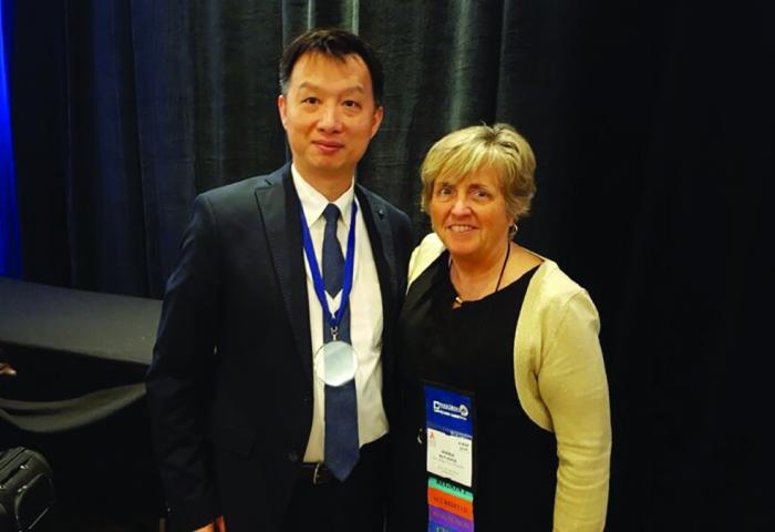 Dr. Rick Lee standing with Dr. Wanda Rutledge after receivin ABCSP award.