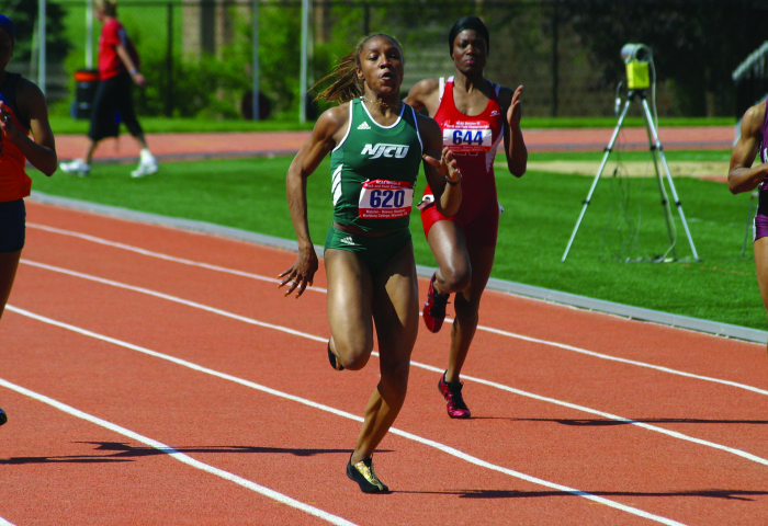 NJCU women's track runner in the lead.