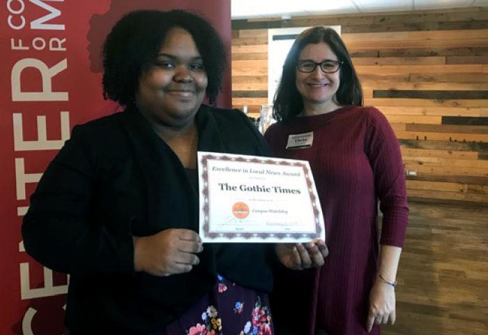 Editor-in-Chief Kenise Brown and adviser Theta Pavis-Weil with award