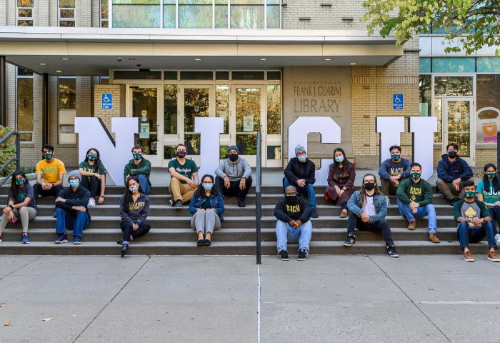 NJCU Students on the steps of the Guarini Library