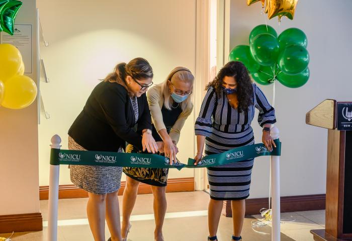 NJCU President Sue Henderson, accompanied by Barbara Ruggieri, Assistant Dean for Social Services and Jennifer Luciano, Associate Dean for Residence Life and Social Services, cut the ribbon during the ceremony.