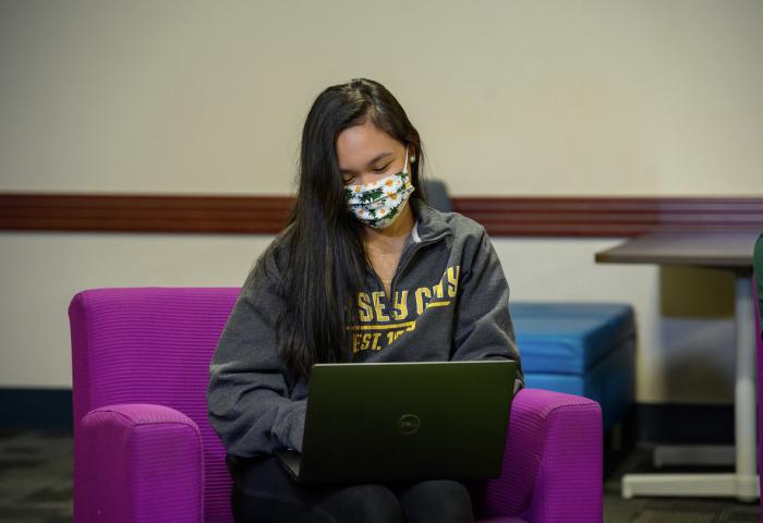 Student in mask in SGA lounge 1220x810