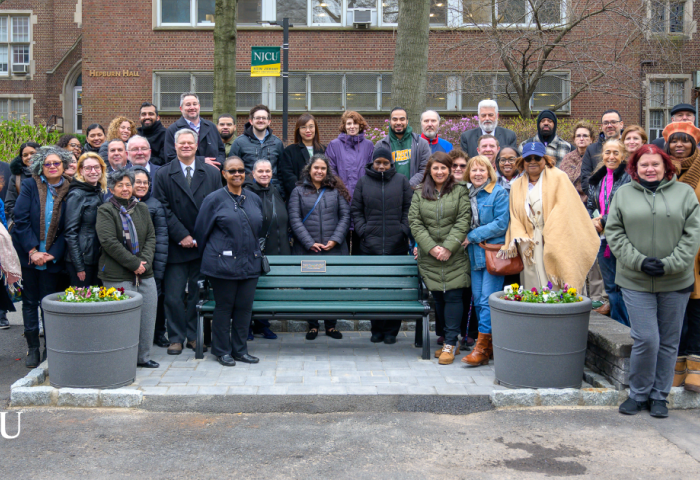 NJCU employees and friends of Dr. Maria Lynn gathered around her memorial bench