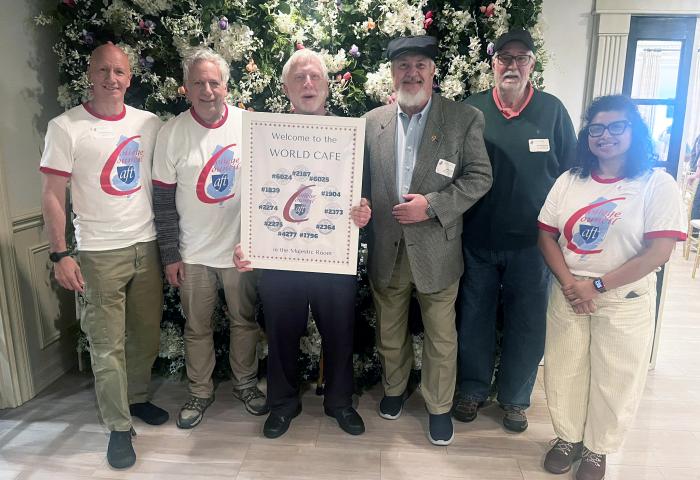AFT leaders at a recent event. AFT Local 1839 Bill Calathes holding a sign in the middle.