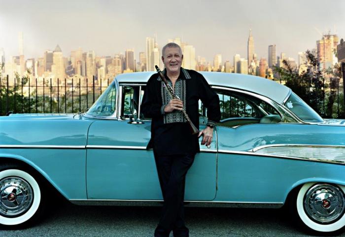 Paquito D'Rivera, jazz star, GRAMMY Award-winner, Hudson County native posing with a classic car and the New York City skyline