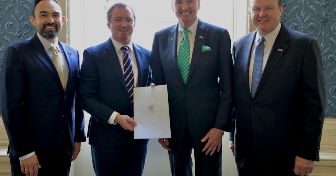 Dr. Adrian Franco and Dr. Bernard McSherry pose for a photo with New Jersey Governor Phil Murphy