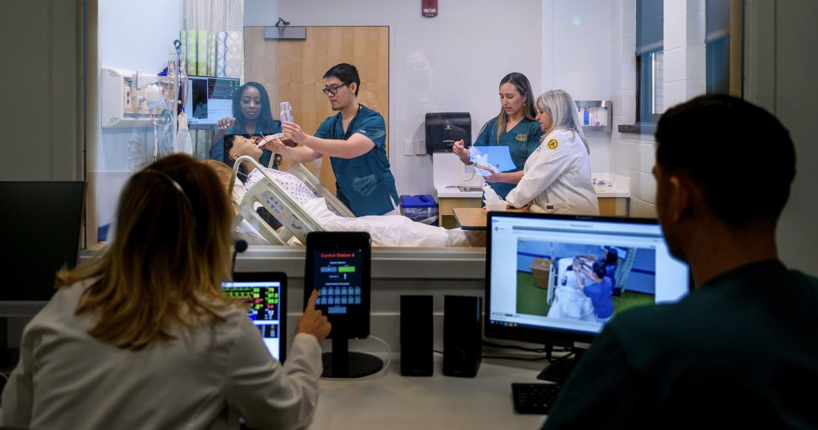 Nursing students using a simulation room for hands-on practice