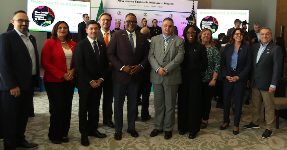 group standing pose university representatives
