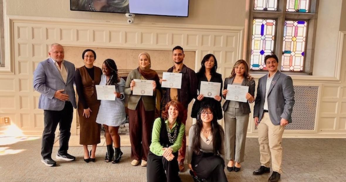 group pose with awards
