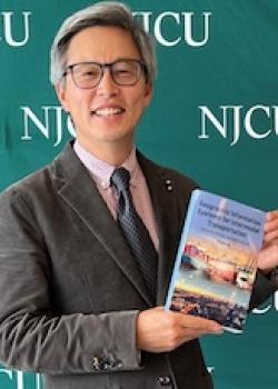 EUNSU POSES WITH HIS BOOK