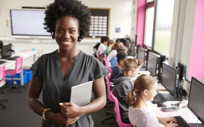 Teacher in Computer Lab with tablet