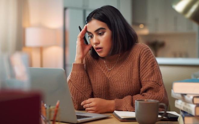 FEMALE AT LAPTOP DISTRESSED