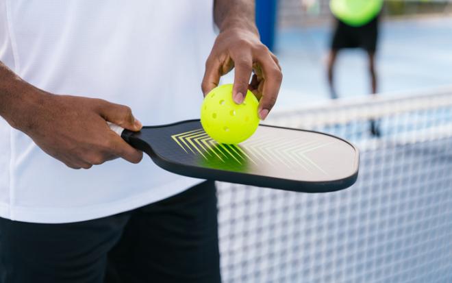 pickleball closeup hands and net
