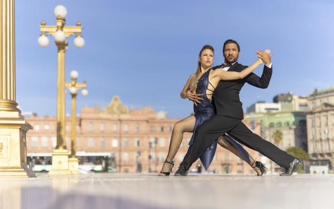 couple in tango dancing pose outdoors