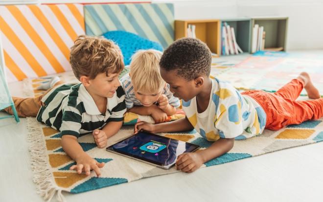 small children play with tablet