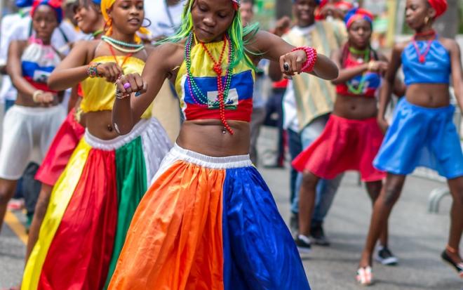 haitain dancers in street perform