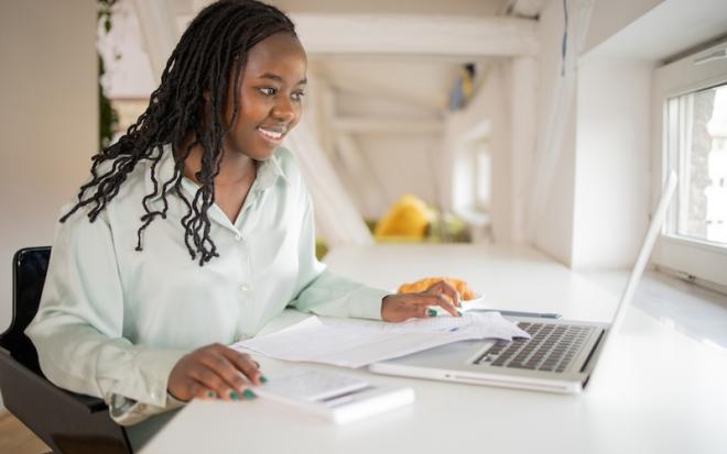 woman at laptop smiling
