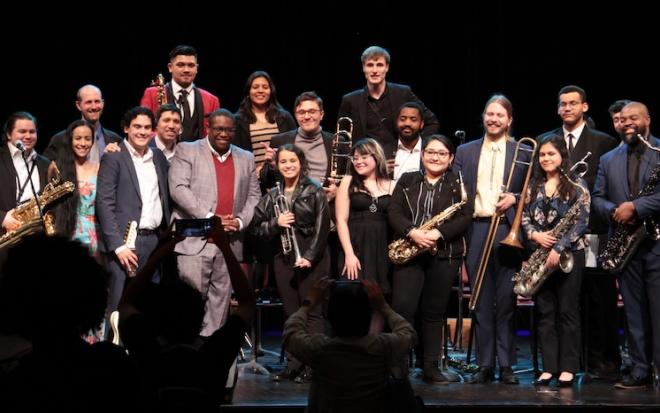 jazz musicians pose on stage