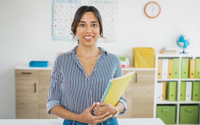 young female teacher with book