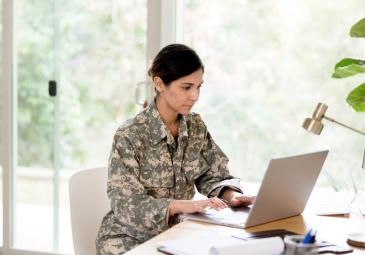 Female soldier on laptop from home