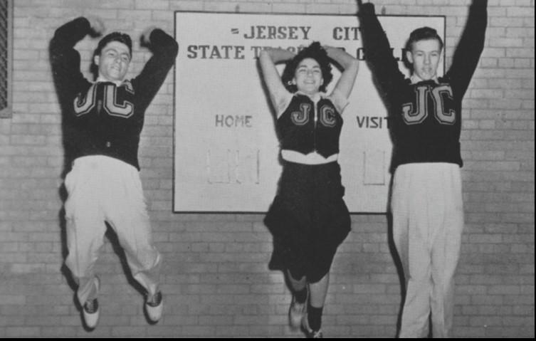 Students cheering on the basketball team.