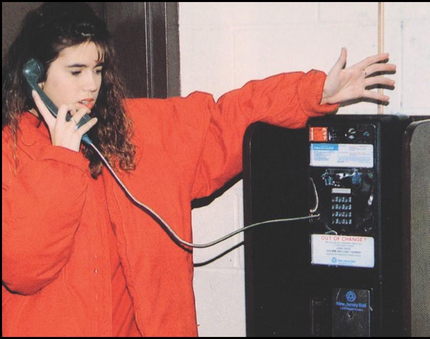 Student makes a pay phone call.