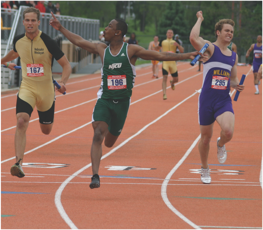 NJCU men's track runner in the lead of a relay race.