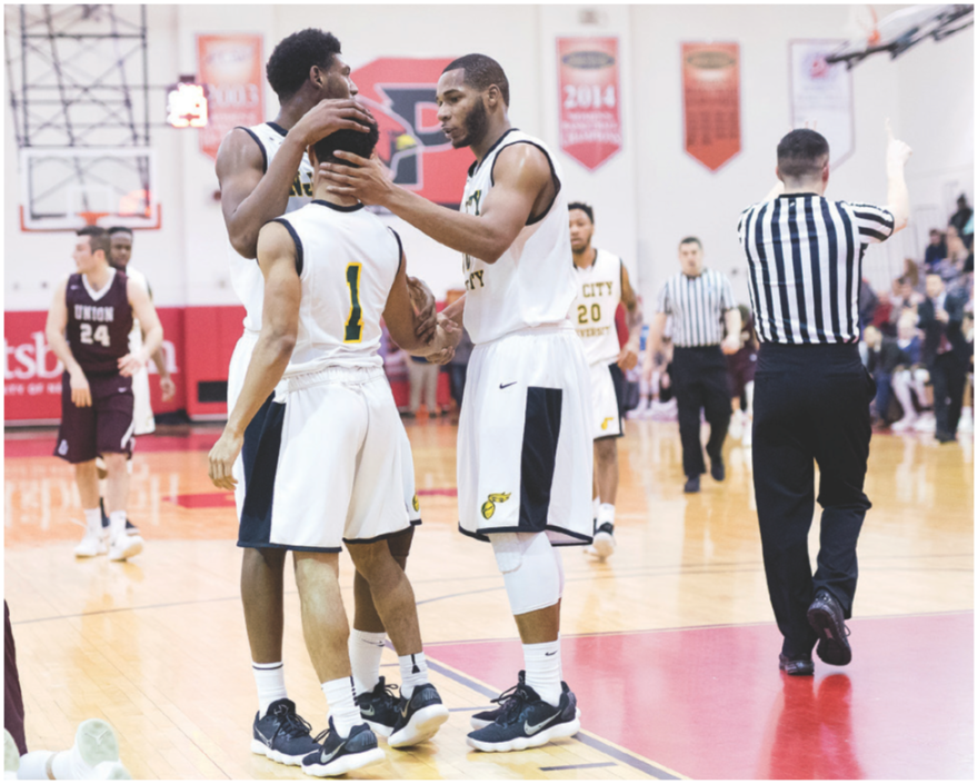 Sam Toney with teammates on the basketball court.