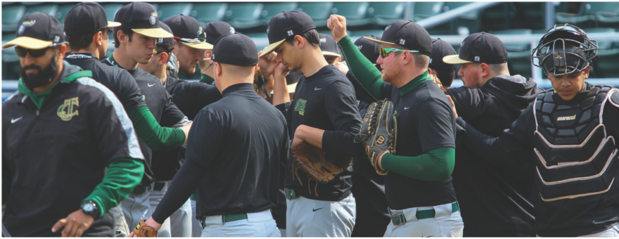 NJCU baseball team celebrating at the end of a game.