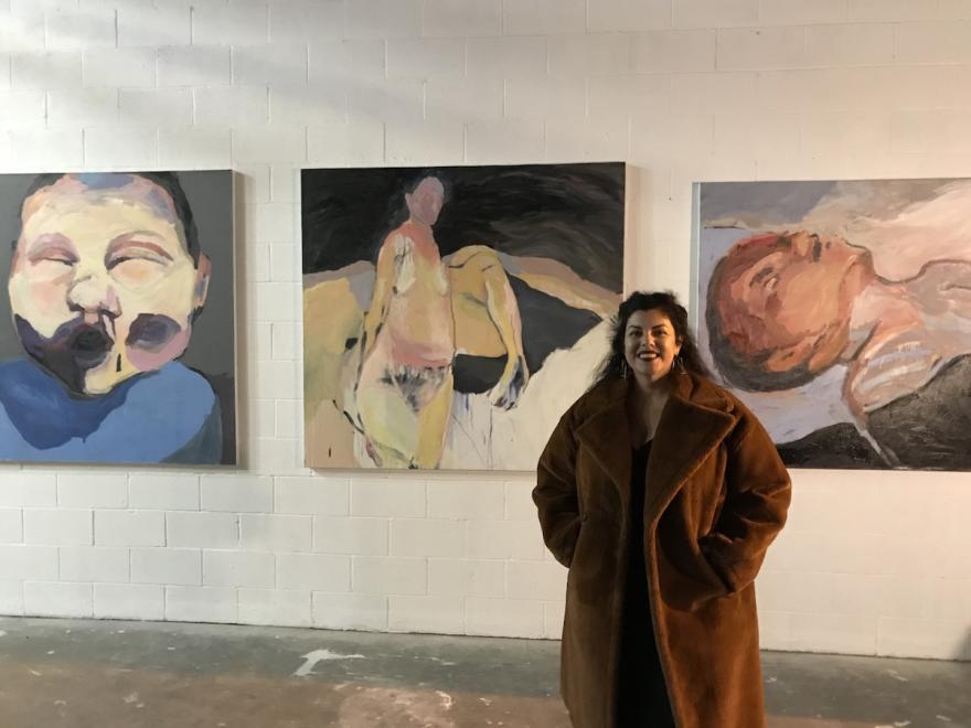 Art Student Displaying Work in Gallery