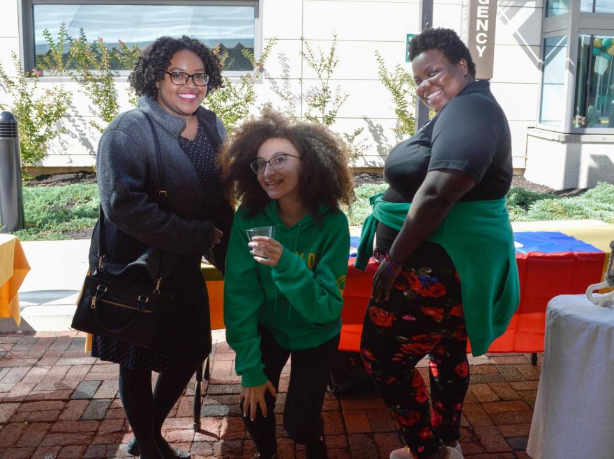 Three Alumni posing at Homecoming 2019