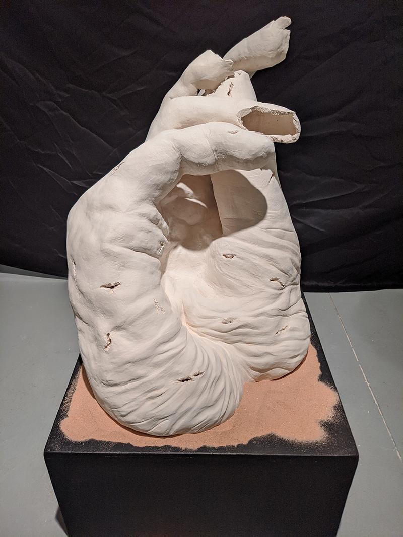 Clay sculpture for Pieces Exhibit of a hand
