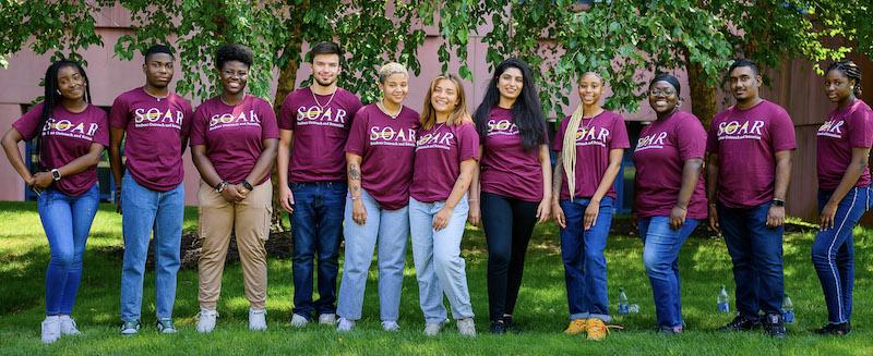 11 SOAR STUDENTS LINED UP IN GRASSY AREA