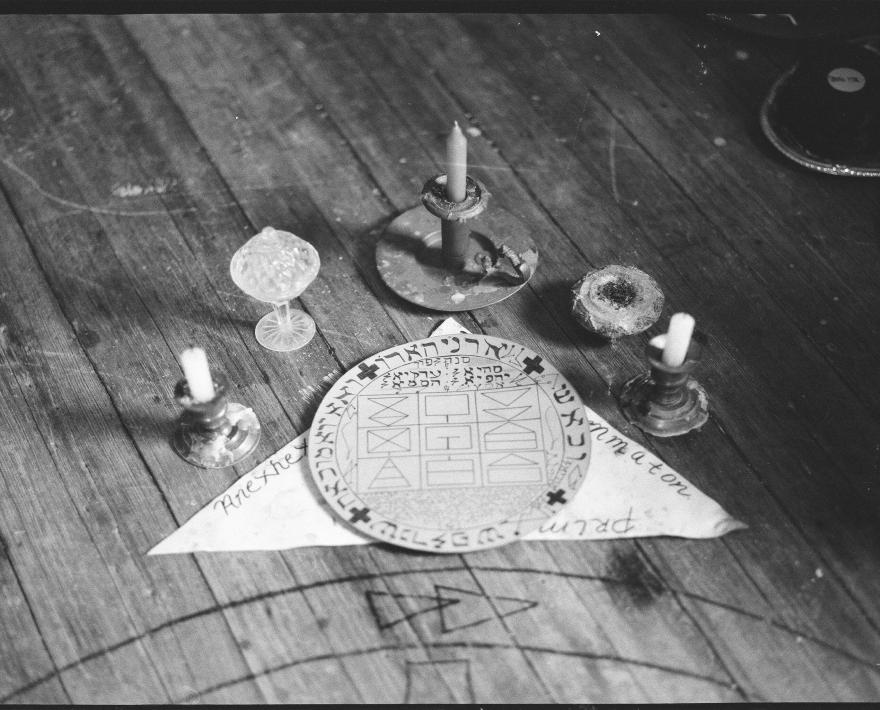 Candles on a floor arranged in prayer