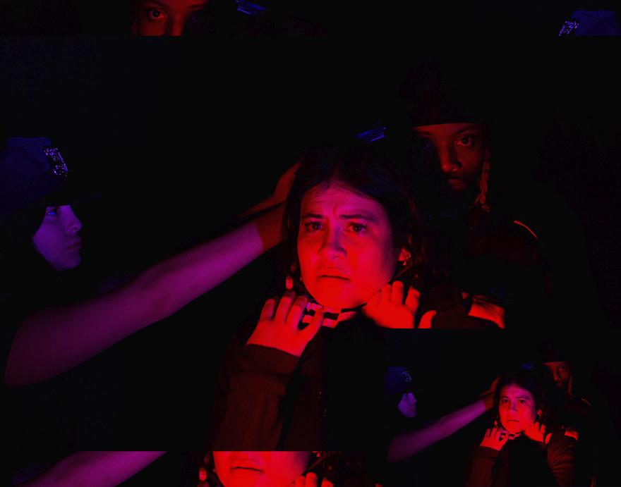 girl being strangled, lit with orange and pink