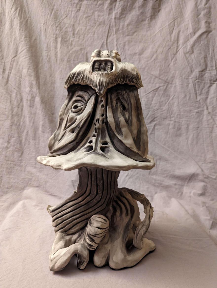 Porcelain statues of a moth upon a human