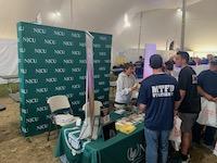 MEN STAND AT NJCU FS TABLE