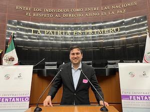 man stands at large podium