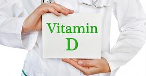 PERSON HOLDING SIGN OF WORDS VITAMIN D