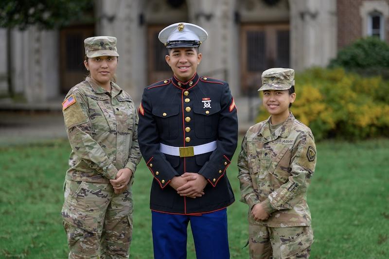 3 veteran students posing